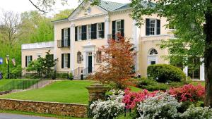 a house with a garden in front of it at Airlie in Warrenton