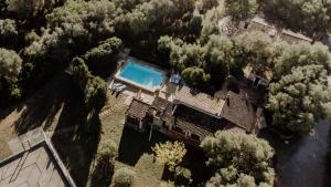 an aerial view of a house with a swimming pool at Casa Piscina Casa Principal in Artá