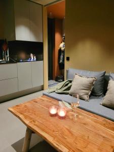 a living room with a table and a couch at Modern Cabin At Blefjell in Svene