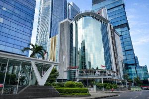 a group of tall buildings in a city at Smart Hotel Thamrin Jakarta in Jakarta