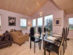 a dining room with a table and chairs at Finest Retreats - Oasis 41 in Fritton