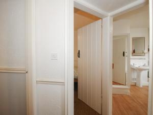 a room with a door leading to a bathroom at 2 Aqueduct Cottages in Wrexham +38 photos