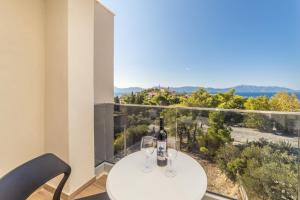 a room with a table and two glasses of wine at Inamore in Gradac +74 photos
