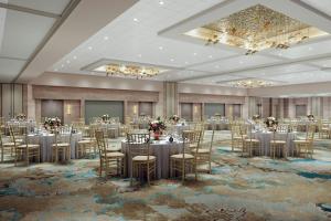 a ballroom with tables and chairs in a room at Irvine Marriott in Irvine