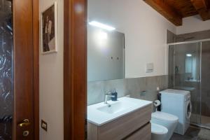 a bathroom with a sink and a toilet at la promenade in Vicenza +36 photos