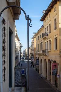 a city street with buildings and a street light at la promenade in Vicenza