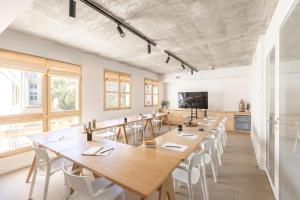 a large dining room with tables and chairs at Babel Community Hôtel - Montpellier centre in Montpellier
