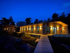 a building with lights on it at night at KSSS Vandrarhem Telegrafholmen in Sandhamn