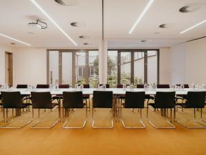 a large conference room with a long table and chairs at Hotel Josef in Prague