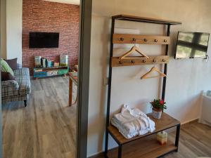 a bedroom with a loft bed and a living room at Casas Rurales Maribel - Complejo Moradas del Cerro 1 - Suites con Jacuzzi en Alcalá del Júcar in Casas del Cerro +70 photos