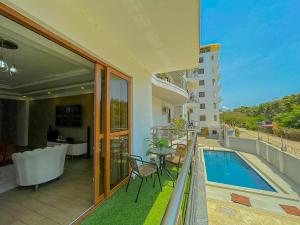 a balcony of a building with a swimming pool at Aqua Epic Residence in Mombasa