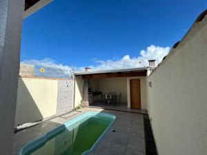 a swimming pool in the backyard of a house at Casa Terra in Prado