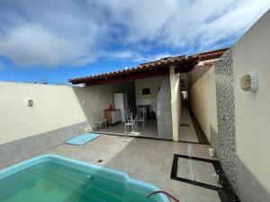 a patio with a swimming pool and a house at Casa Terra in Prado