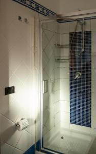 a shower with a glass door in a bathroom at Hotel Sirio in Lampedusa +27 photos