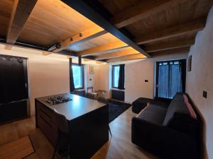 a living room with a couch and a table at Muranche Loft S1 in Valtournenche