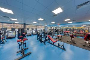 a gym with a lot of treadmills and machines at Grand Hotel Kapan, Armenia in Kapan