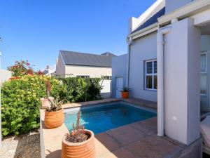 a swimming pool in the backyard of a house at Salt & Butter in Hermanus