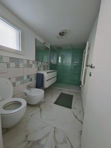 a bathroom with a toilet and a sink at Casa Sole in Cannobio