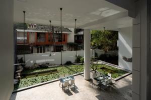 a view from the balcony of a building with a garden at Urban Opulence in Bangalore