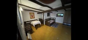 an overhead view of a living room with a table at Kotlós Tanya in Zákányszék