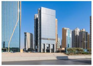 a view of a city with tall buildings at Vittori Garden in Riyadh