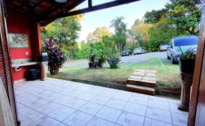 an open door of a house with a driveway at Della Vegas Economy in Serra Negra +5 photos