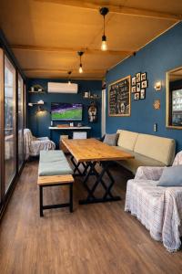 a living room with a table and a couch at Gold Coast Hostel in Antalya