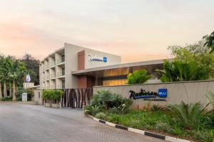 a hotel on the side of a road at Radisson Blu Hotel & Residence Nairobi Arboretum in Nairobi