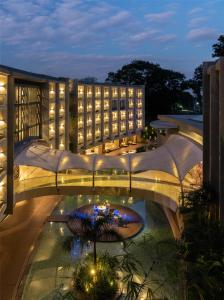 a view of a building with a courtyard at night at Radisson Blu Hotel & Residence Nairobi Arboretum in Nairobi +144 photos