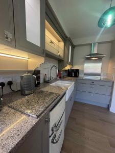a kitchen with a sink and a counter top at Apartment No 4 in Bridlington