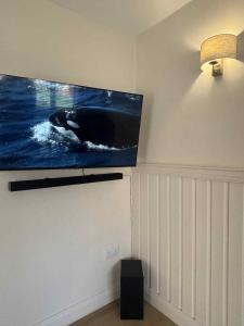 a flat screen tv hanging on a wall at Apartment No 4 in Bridlington