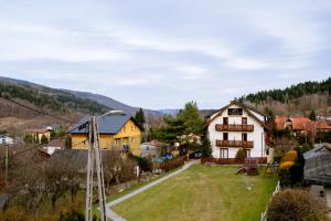 a village in the mountains with a house at Aldian Pokoje Gościnne in Szczyrk