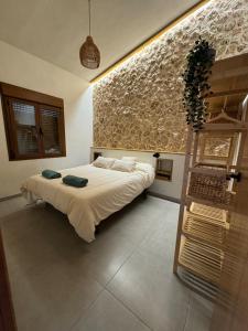 a bedroom with a bed and a wooden ladder at Villa Loma de Bas 1 y 2 in Águilas