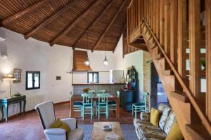 a living room with a couch and a table at ALOJAMIENTO TURISTICO- AGROTURISMO Dehesa La Pared in Chillón