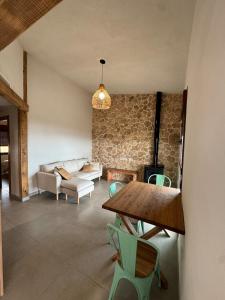 a living room with a table and a couch at Villa Loma de Bas 1 y 2 in Águilas