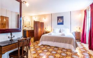 a bedroom with a bed and a desk and a sink at Justin de Provence in Orange +85 photos