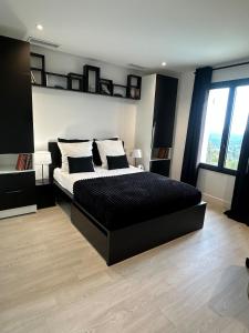 a bedroom with a large bed and a large window at Prestige villa Estrella in Fayence +37 photos
