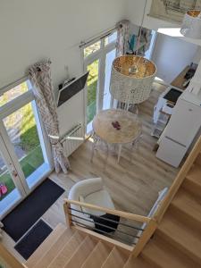 an overhead view of a room with a table and chairs at Penuel Tiny House in Granville