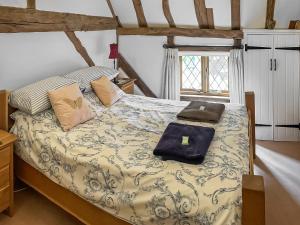 a bedroom with a bed and a window at Rumbolds Retreat in Plaistow +10 photos