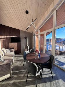 a living room with a table and chairs and a couch at Evelin in Maidan Village
