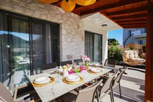 a dining room with a table and chairs at Villa Lidya in Dalyan
