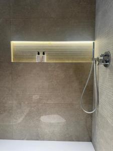 a bathroom with a shower with a shower head at Hotel Vitruvio in Milan +137 photos