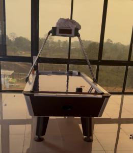 a boat on display in front of a window at The Sixth Abode Farms 5 BHK Villa with Swimming Pool, Turf, Lawn & Indoor Games- Khopoli in Jambhulpāda