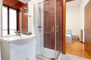 a bathroom with a sink and a shower at Residenza Santa Rita in Novara +55 photos