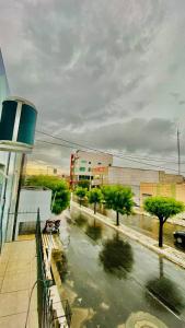 a view from a balcony of a street with trees at Ap com ar próximo ao centro in Crateús