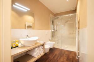 a bathroom with a sink and a shower at Hotel Ristorante Ala d'Oro in Lugo
