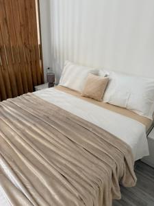 a large bed with white sheets and pillows at Golden LUX in Bar +33 photos