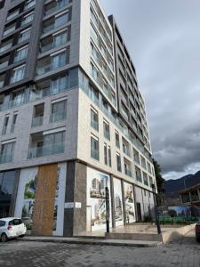 a tall building with posters on the side of it at Golden LUX in Bar