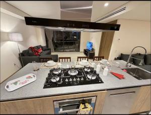 a kitchen with a stove top in a living room at Nima bay in Puerto Vallarta