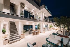 a large living room with couches and a staircase at Senator Lux in Ulcinj